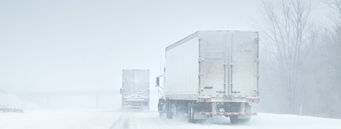 Shipping Trucks In Transit Winter Storm