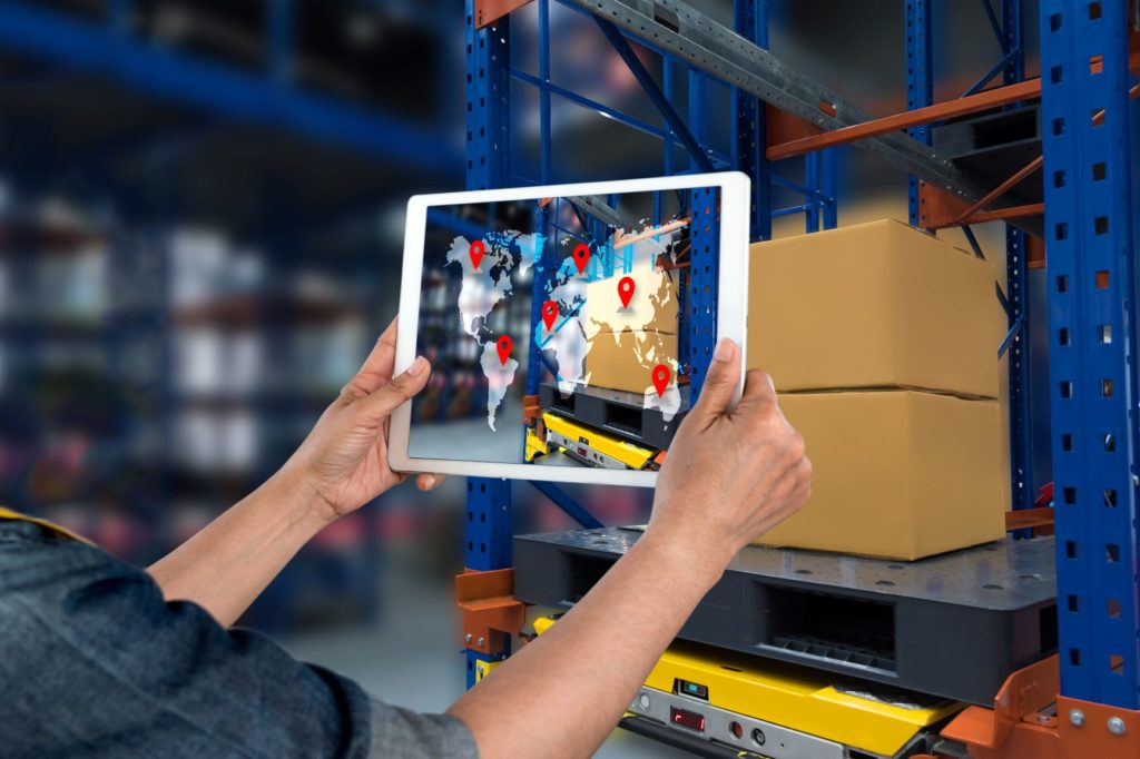 Tablet with supply chain map in warehouse.